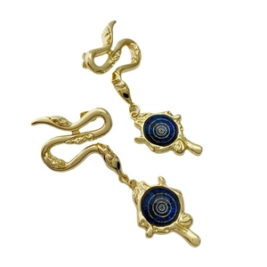 Vintage gold snake earrings with deep blue eye pattern pendants on a white background