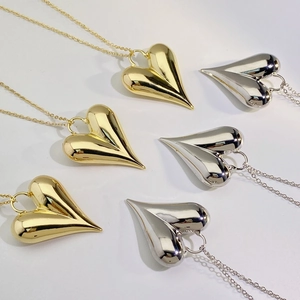 Minimalist 18K gold and silver plated heart pendant necklaces in polished finish