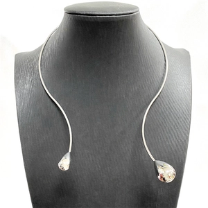 Minimalist silver geometric choker necklace with large polished metal water drop pendants