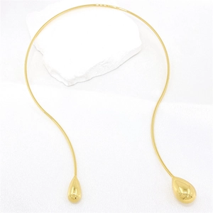 Gold-toned minimalist open collar necklace featuring high-polish teardrop design accents