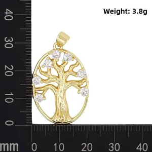 Golden Tree of Life pendant with white zircons shown on scale measuring 30mm height