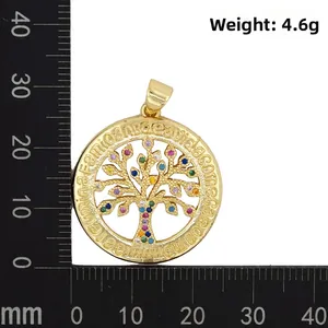 Macro shot of colorful Tree of Life pendant measuring 35mm on a measurement scale