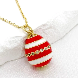 Elegant 14K gold-plated Easter egg pendant necklace with red stripes and zircon crystals