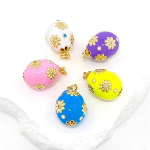 Five assorted Easter egg pendants with 14K gold floral engraving and colorful enamel finish