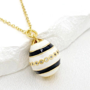 Gold 14K plated Easter egg pendant necklace with white enamel and black striped zircon