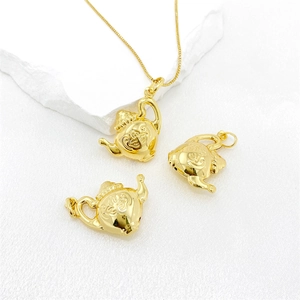 Collana con ciondolo a teiera vintage in rame con finitura dorata e trama a rilievo