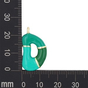 Macro shot of green enamel letter D bubble pendant showing 25mm size on scale