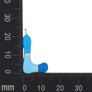 Macro view of blue enamel letter L pendant with dimensions on a measuring ruler