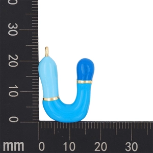 Detailed size measurement of a blue enamel bubble letter U pendant on a metric scale