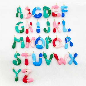 Set of 26 colorful enamel bubble letter pendants with gold metal loops for DIY jewelry making