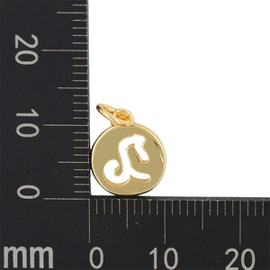Detailed macro view showing a 12mm gold Leo zodiac pendant with measurement scale