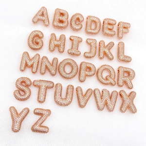 Rose gold 26 letters 3D bubble zircon pendants on soft pink satin background