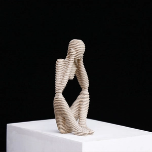 Modern thinker sculpture with sandstone texture on a white base for home office decor