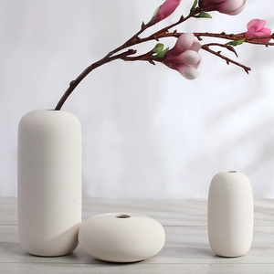 Three-piece ceramic minimalist vase set with ribbed texture for home decor