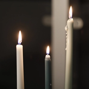 Burning Nordic Morandi gradient taper candles in blue and grey for romantic dinner decor