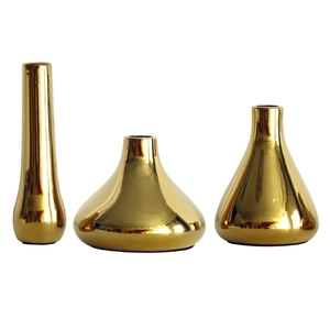 Minimalist Nordic style gold ceramic vase set with three different geometric shapes
