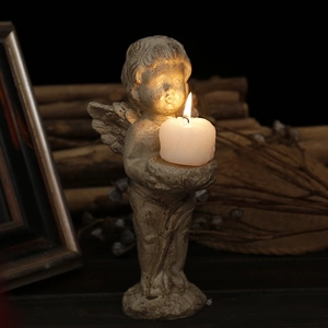 Vintage Nordic cherub angel candle holder with antique stone texture and flickering candle