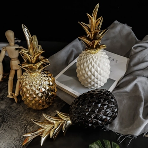 Minimalist ceramic pineapple decor with geometric texture and gold leaf accent in three colors