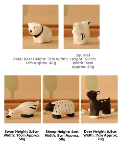 Miniature ceramic animal figurines featuring polar bear, swan, and deer for desk decor
