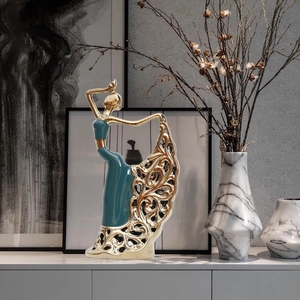 Modern ceramic peacock dancer sculpture with gold hollow skirt for luxury home decor