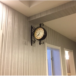 Reloj de pared de doble cara en hierro forjado de estilo europeo con diseño vintage