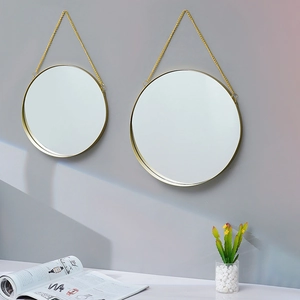 Set of two Nordic round wall mirrors with golden metal frames and hanging chains