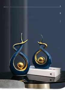 Detail of luxury ceramic abstract ornaments with blue glaze and gold plated wave design