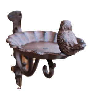 Cast iron bird feeder wall hook with antique rust finish and scallop tray design