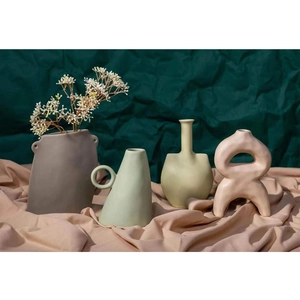 Modern Nordic ceramic vases set in matte pastel colors with minimalist organic shapes