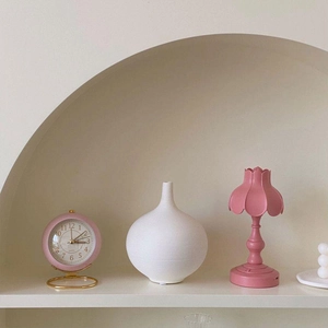 Detail of a white textured ceramic vase in a modern minimalist interior setting