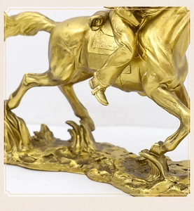 Close-up of golden horse sculpture legs with detailed texture on a white background