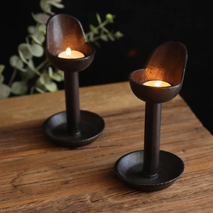 Vintage iron candlestick set with rustic brown finish for home and tea room decor