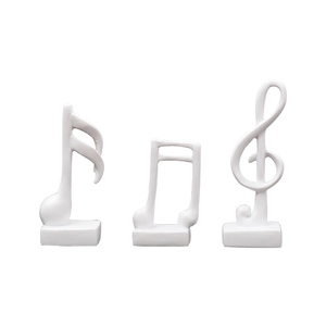 Minimalist white musical note figurines set on rectangular bases for modern home decor