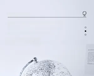Macro shot of a transparent decorative globe with fine printed details and silver stand