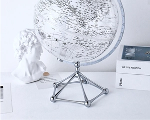 Detailed view of transparent globe with silver geometric base and Chinese map markings