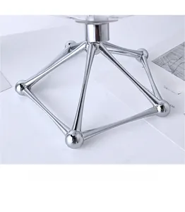 Detail of creative silver geometric metal base with polished electroplated finish