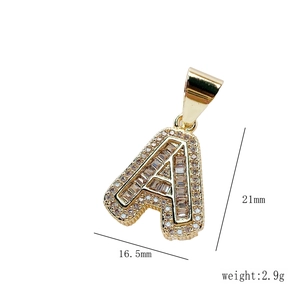 Detailed view of iced out letter A pendant in gold with crystal zircon stones and size info