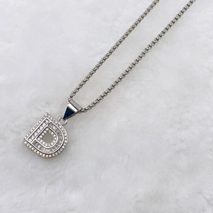 Detailed view of silver letter D pendant necklace featuring micro-paved cubic zirconia