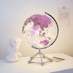 Luminous purple globe ornament with silver metal stand and LED lights for home decor