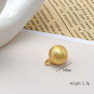 Detail of 10mm frosted gold-plated copper bead pendant with closed loop for DIY jewelry