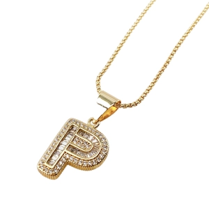 Luxurious gold necklace with cubic zirconia letter P pendant on a polished box chain