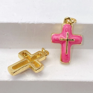 Detail of pink enamel cross charms with gold plating for DIY jewelry necklaces