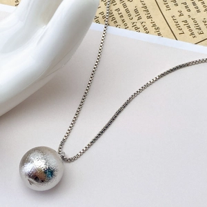 Modern hollow brushed copper ball pendant with box chain in polished silver finish