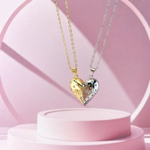 Detailansicht der magnetischen Herz-Halsketten in Gold und Silber mit EKG-Muster und Zirkonia