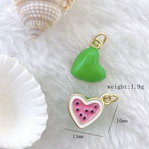 Detailed close-up of handmade enamel watermelon heart charms in 13mm by 10mm size