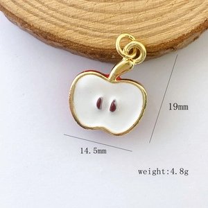 Detail of red apple pendant with enamel finish showing dimensions 19mm by 14.5mm and weight