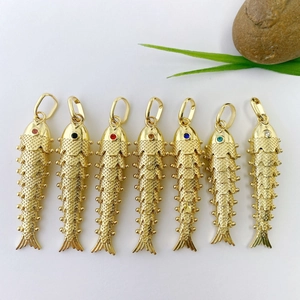 Set of 7 gold-plated koi fish pendants with colorful gemstone eyes and scales