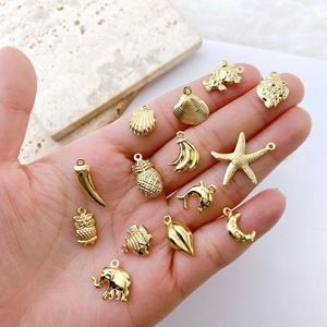 Golden mini metal charms including moon and animal shapes for DIY jewelry making