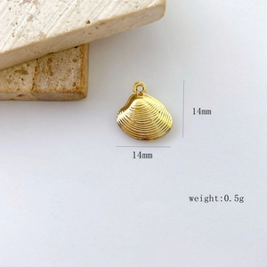 Detail of 14mm gold shell pendant with fine striped texture and top loop for DIY jewelry