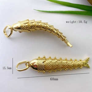 Articulated koi fish pendant in gold plating with red gem eyes and size dimensions